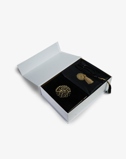 prayer kit with a prayer rug and quran 